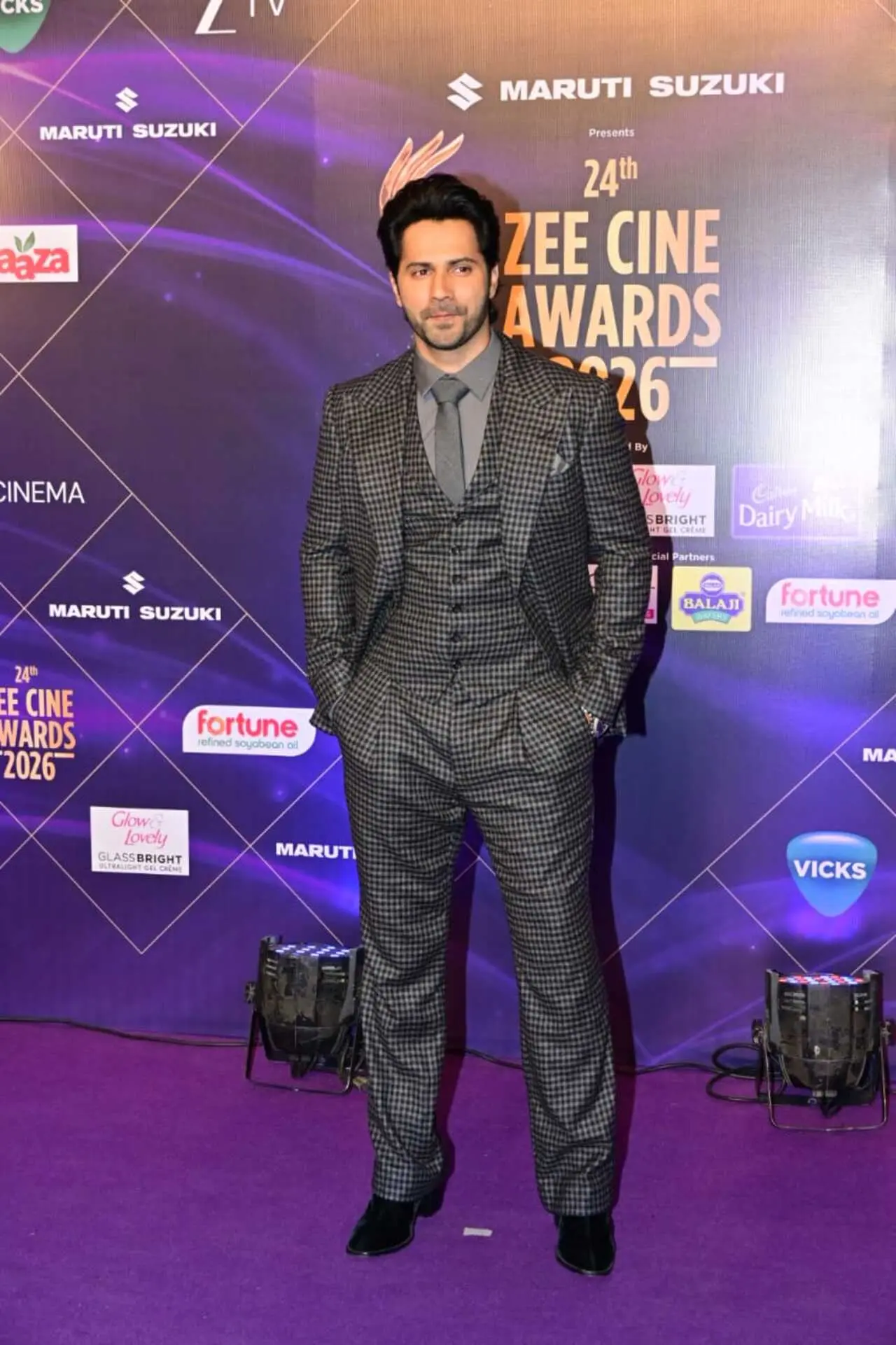 Varun Dhawan also made a suited up appearance in the city ina grey stripped suit.